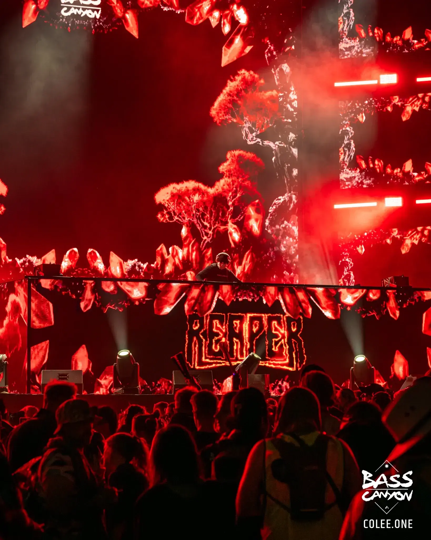 Red-lit performer framed by fiery graphics across stacked stage screens, Bass Canyon 2023 at The Gorge Amphitheatre, George, Washington